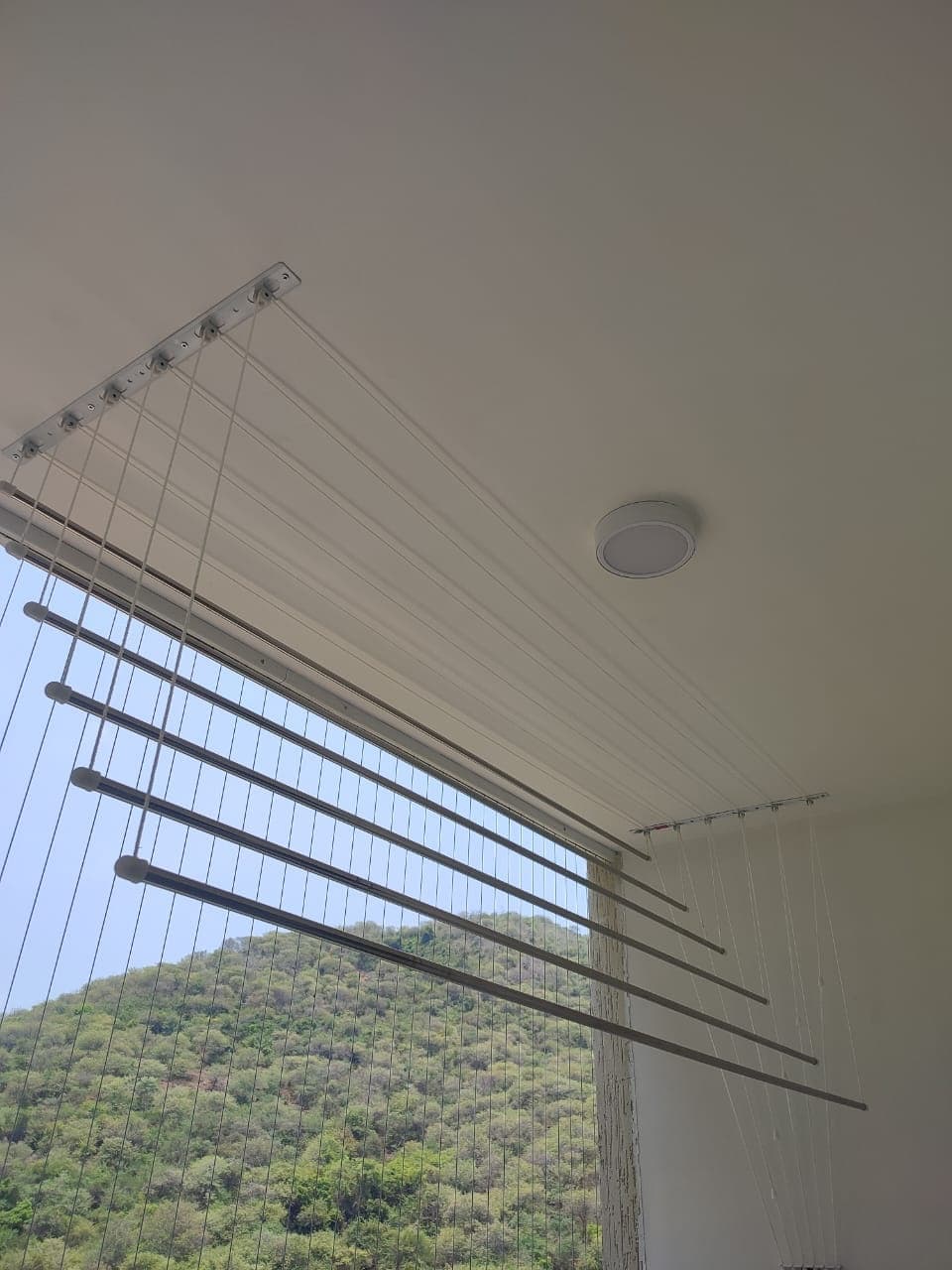 Ram Enterprises - Ceiling Cloth Hangers - Dual-pipe ceiling pulley hanger system drying clothes space-efficiently.